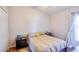 Neutral bedroom design featuring a bed, wood flooring, closet, neutral walls and a window at 4381 Creekside Blvd, Kissimmee, FL 34746
