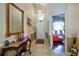 Inviting foyer with decorative mirror and decor, leading into a bright, spacious living area at 4381 Creekside Blvd, Kissimmee, FL 34746
