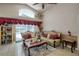 Elegant living room featuring two sofas, a ceiling fan, and sliding glass door to backyard at 4381 Creekside Blvd, Kissimmee, FL 34746