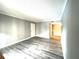 Spacious living area featuring wood-look flooring and freshly painted walls at 455 Wymore Rd # 203, Altamonte Springs, FL 32714