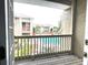 Relaxing patio view of the community pool, buildings, and lush landscaping at 455 Wymore Rd # 203, Altamonte Springs, FL 32714