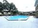 Large community pool with plenty of space for swimming and lounging in the sun at 455 Wymore Rd # 203, Altamonte Springs, FL 32714