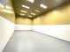 Indoor racquetball court with white and yellow walls and a gray floor at 455 Wymore Rd # 203, Altamonte Springs, FL 32714