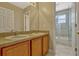 Bathroom features a double sink vanity with modern fixtures and a separate shower room at 4574 Ficus Tree Rd, Kissimmee, FL 34758