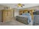 This bedroom offers carpet flooring, plenty of storage space, and comfortable bedding at 4574 Ficus Tree Rd, Kissimmee, FL 34758