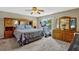 Bedroom with carpet flooring, ample closet space, and comfortable bedding, plus a workout area at 4574 Ficus Tree Rd, Kissimmee, FL 34758