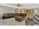 Open-concept living room showcasing kitchen, seating and marble flooring at 4574 Ficus Tree Rd, Kissimmee, FL 34758