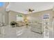 Spacious living room with marble floors, ceiling fan and bright windows at 4574 Ficus Tree Rd, Kissimmee, FL 34758