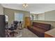 A versatile loft area with a sofa, desk, and filing cabinet, perfect for a home office or additional living space at 4574 Ficus Tree Rd, Kissimmee, FL 34758