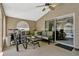 Covered patio with comfortable seating, bikes, and a view of the backyard pool area at 4574 Ficus Tree Rd, Kissimmee, FL 34758
