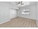 Bedroom with a carpeted floor, window, ceiling fan, and closet at 4584 Pheasant Run Dr # B, Orlando, FL 32808