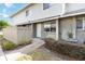 Inviting two-story townhome with neutral siding and a cozy front entrance at 4584 Pheasant Run Dr # B, Orlando, FL 32808