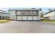 Exterior shot of a condo with garages and balconies at 4584 Pheasant Run Dr # B, Orlando, FL 32808