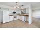 Functional kitchen with white appliances, cabinetry, and a tiled floor at 4584 Pheasant Run Dr # B, Orlando, FL 32808