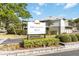 Community sign for Pheasant Run at Rosewood Town Condominiums, with lush landscaping at 4584 Pheasant Run Dr # B, Orlando, FL 32808