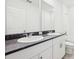 Bathroom features double sinks, modern fixtures, and white cabinets at 4713 Jasmine Cir, Leesburg, FL 34748