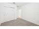 Neutral bedroom with closet space and neutral walls and flooring for a calm feel at 4713 Jasmine Cir, Leesburg, FL 34748