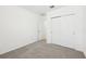 Neutral bedroom with closet space and neutral walls and flooring for a calm feel at 4713 Jasmine Cir, Leesburg, FL 34748