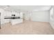 Bright, open-concept kitchen with a center island, stainless appliances, and white cabinets at 4713 Jasmine Cir, Leesburg, FL 34748