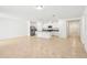 Bright, open living room with an island that connects to the kitchen with modern appliances at 4713 Jasmine Cir, Leesburg, FL 34748