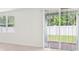 Bright, open living room with large windows and sliding door to the backyard at 4713 Jasmine Cir, Leesburg, FL 34748