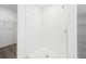All white stand up shower with glass doors and built in shelving at 4713 Jasmine Cir, Leesburg, FL 34748