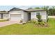 Single-story home with a brick driveway, attached garage and inviting curb appeal at 4717 Jasmine Cir, Leesburg, FL 34748