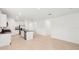 Spacious kitchen and dining area boasts modern appliances, white cabinets, and ample natural light at 4717 Jasmine Cir, Leesburg, FL 34748