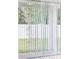Sliding glass doors leading to an outdoor patio space at 4717 Jasmine Cir, Leesburg, FL 34748