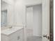 Well-lit bathroom offers a sleek vanity with a modern sink and fixtures at 4728 Jasmine Cir, Leesburg, FL 34748