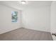 This bedroom offers a comfortable feel with neutral walls, soft carpet, and natural lighting at 4728 Jasmine Cir, Leesburg, FL 34748