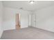 Bedroom featuring plush carpet, white walls, a ceiling light, and a closet at 4728 Jasmine Cir, Leesburg, FL 34748