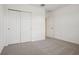 This bedroom has neutral walls, soft carpet and sliding-door closet and ample space at 4728 Jasmine Cir, Leesburg, FL 34748