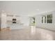 Bright open-concept kitchen and living area with natural light and neutral tones at 4728 Jasmine Cir, Leesburg, FL 34748