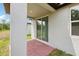Covered back patio with brick flooring at 4732 Jasmine Cir, Leesburg, FL 34748