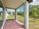 Covered back patio with view of the backyard at 4732 Jasmine Cir, Leesburg, FL 34748