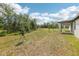 Large backyard view from covered patio at 4732 Jasmine Cir, Leesburg, FL 34748