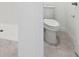 Bathroom with tiled flooring, shower, and toilet at 4732 Jasmine Cir, Leesburg, FL 34748