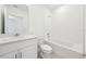 Bright bathroom with a tub, toilet and vanity at 4732 Jasmine Cir, Leesburg, FL 34748
