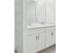 Bathroom featuring double sinks and storage at 4732 Jasmine Cir, Leesburg, FL 34748