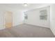 Spacious bedroom with neutral carpet and two windows, filled with natural light at 4732 Jasmine Cir, Leesburg, FL 34748