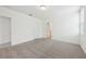 This carpeted bedroom has a bathroom and closet in the corner of the room at 4732 Jasmine Cir, Leesburg, FL 34748