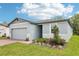An inviting one-story home with a two-car garage, with a well-maintained lawn and landscaping at 4732 Jasmine Cir, Leesburg, FL 34748