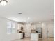 A kitchen with an island, stainless steel appliances, and white cabinets at 4732 Jasmine Cir, Leesburg, FL 34748