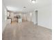 A living room with a kitchen, stainless steel appliances, tile floors, and an island at 4732 Jasmine Cir, Leesburg, FL 34748