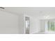Living room with tile floors, a sliding glass door to the backyard, and neutral walls at 4732 Jasmine Cir, Leesburg, FL 34748