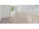 Living room with tile floors and a sliding glass door with views to the backyard at 4732 Jasmine Cir, Leesburg, FL 34748