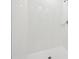 Shower with modern white tile, showcasing a clean and updated bathroom space at 4732 Jasmine Cir, Leesburg, FL 34748