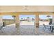 Community pool with a covered patio area with stone pillars, ceiling fans, and pavers at 4981 Kaia Ave, Winter Haven, FL 33884