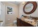 Cozy bathroom with vanity and a window view above the toilet at 5537 Misty Woods Dr, Oviedo, FL 32765